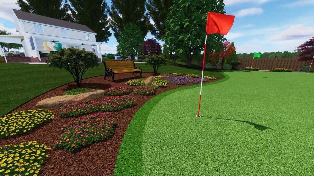 Lush backyard golf putting green with flowers, bench, and red flags.