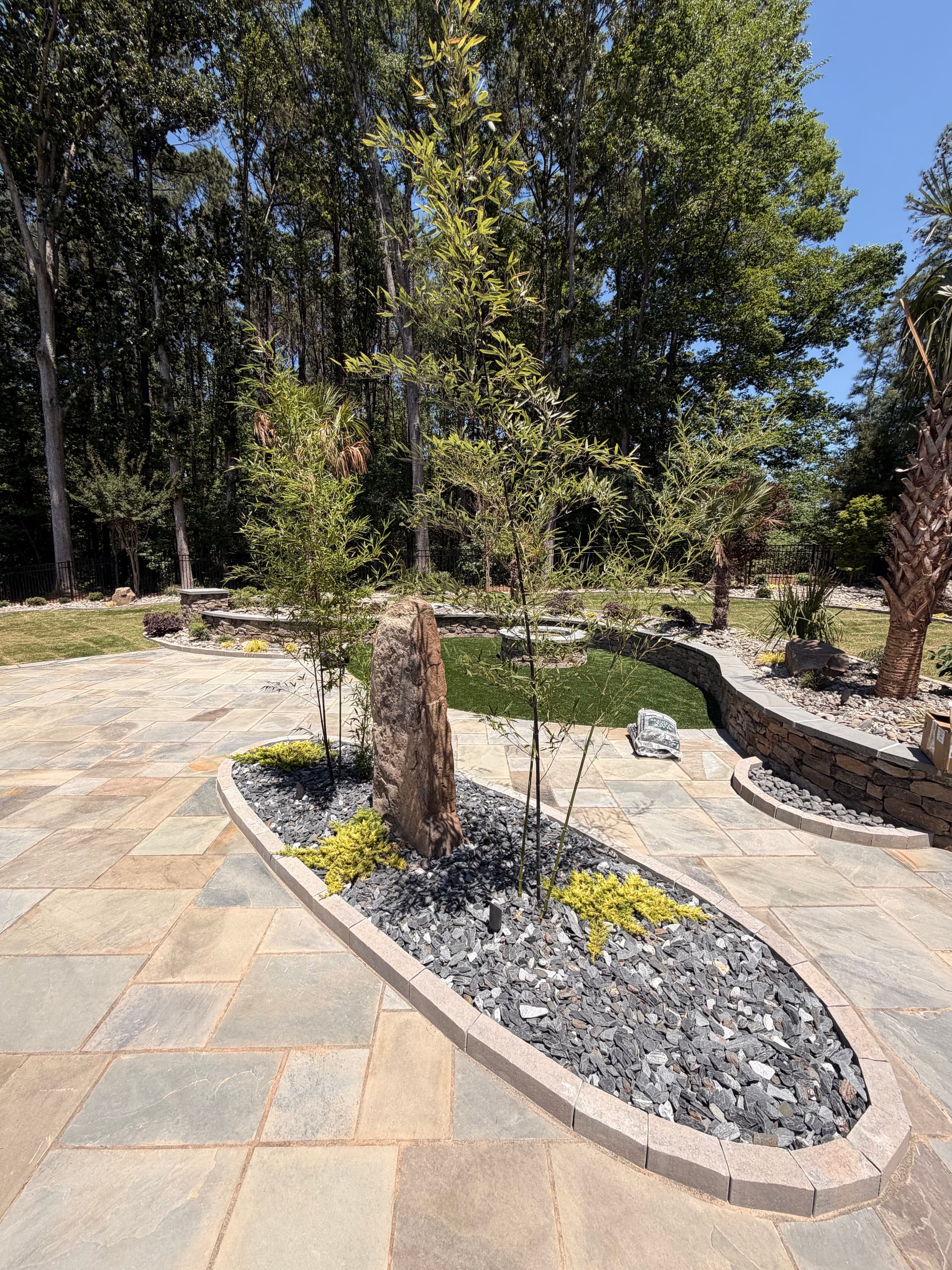 Gallery photos for Custom Backyard Design with Fire Pit Retaining Walls and Garden Features: Image #1