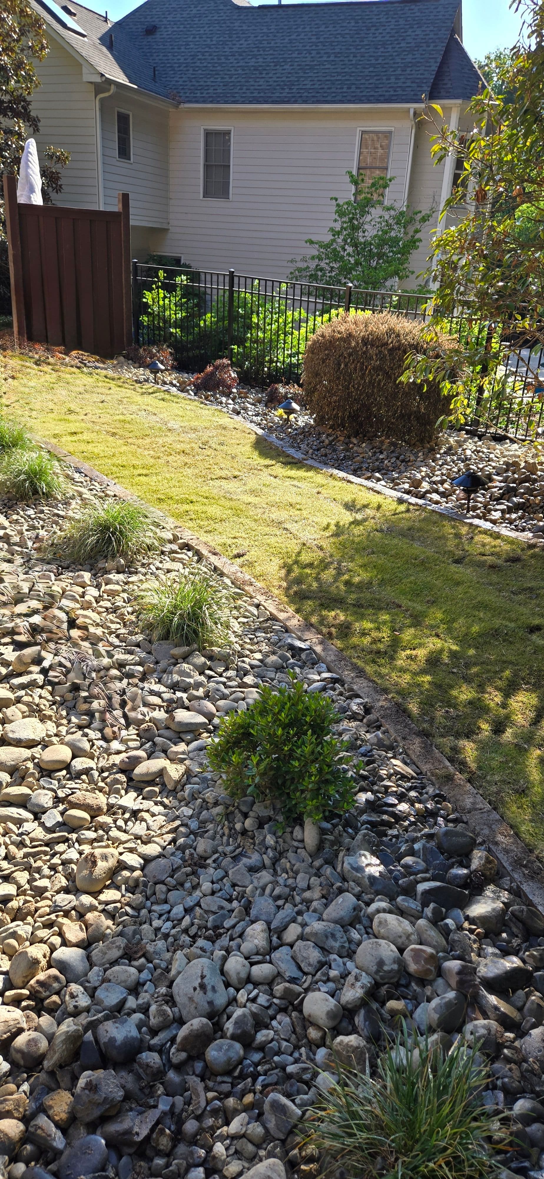 Fresh Zoysia Sod and Gravel Accents Tie Together a Cary Backyard image
