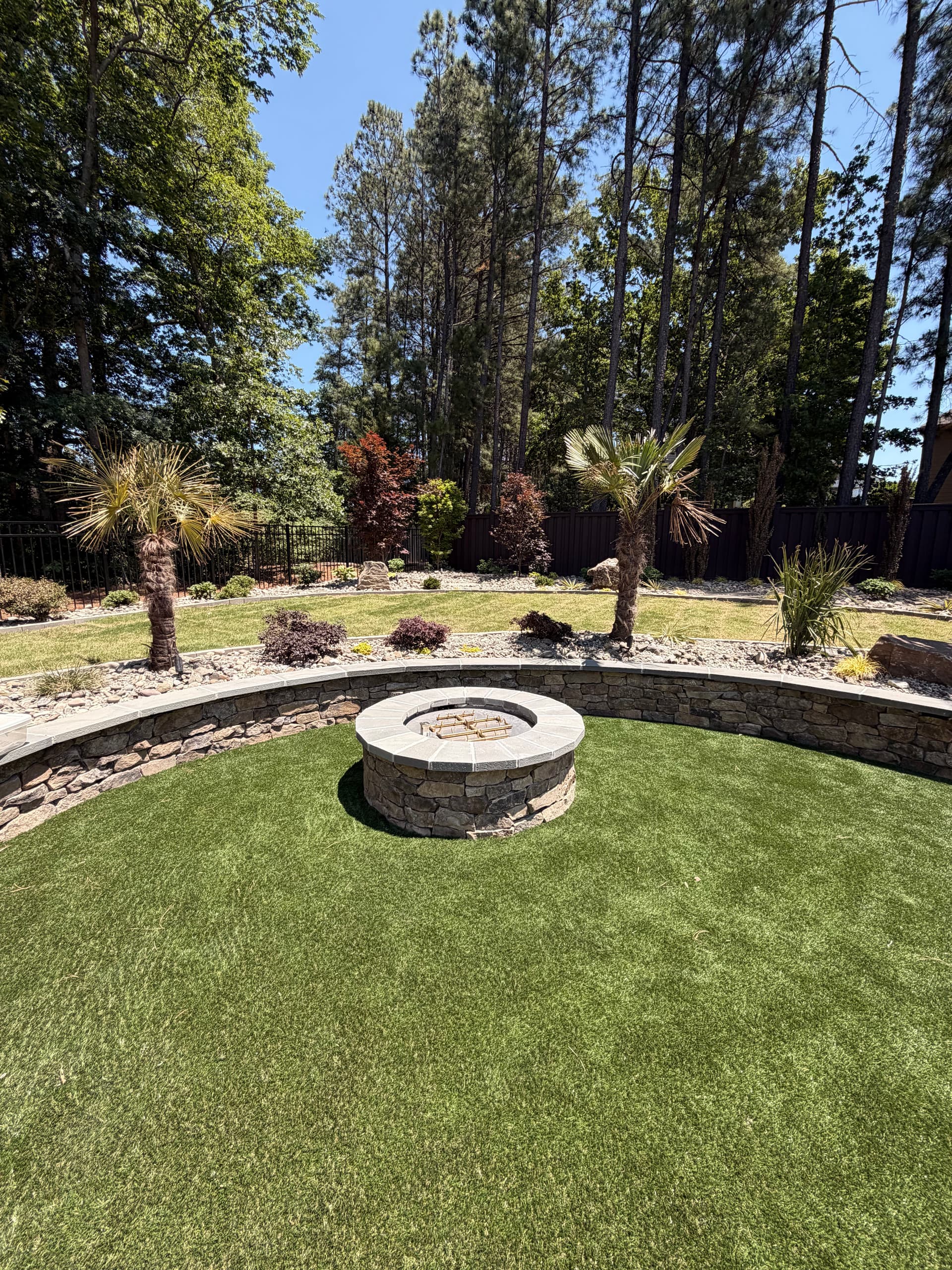 Gallery photos for Custom Backyard Design with Fire Pit Retaining Walls and Garden Features: Image #2