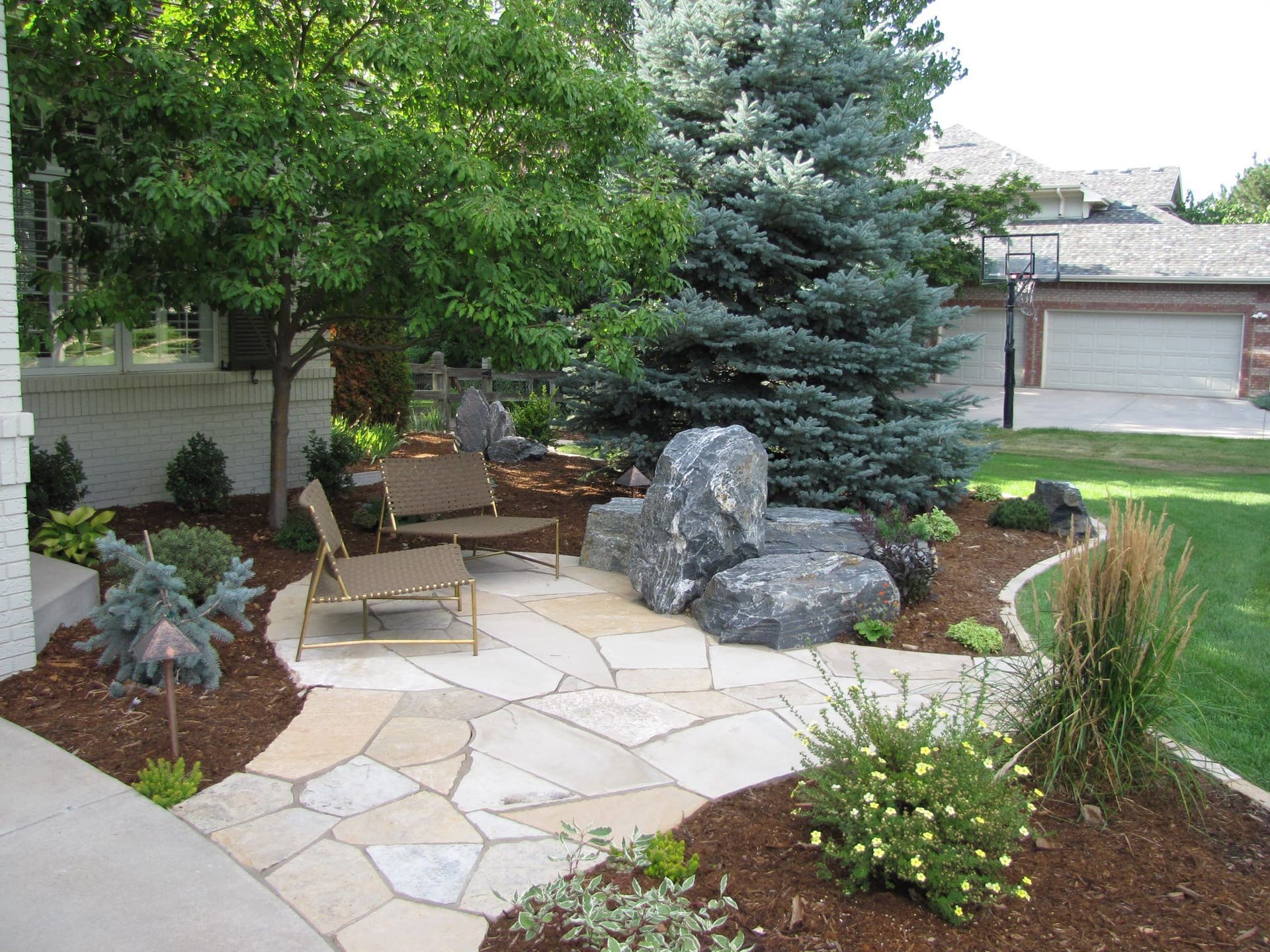 Backyard Makeover with Patio and Boulders image