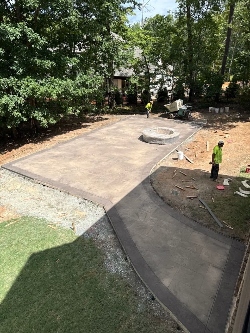 Backyard Transformation with Stamped Concrete and Fire Pit image