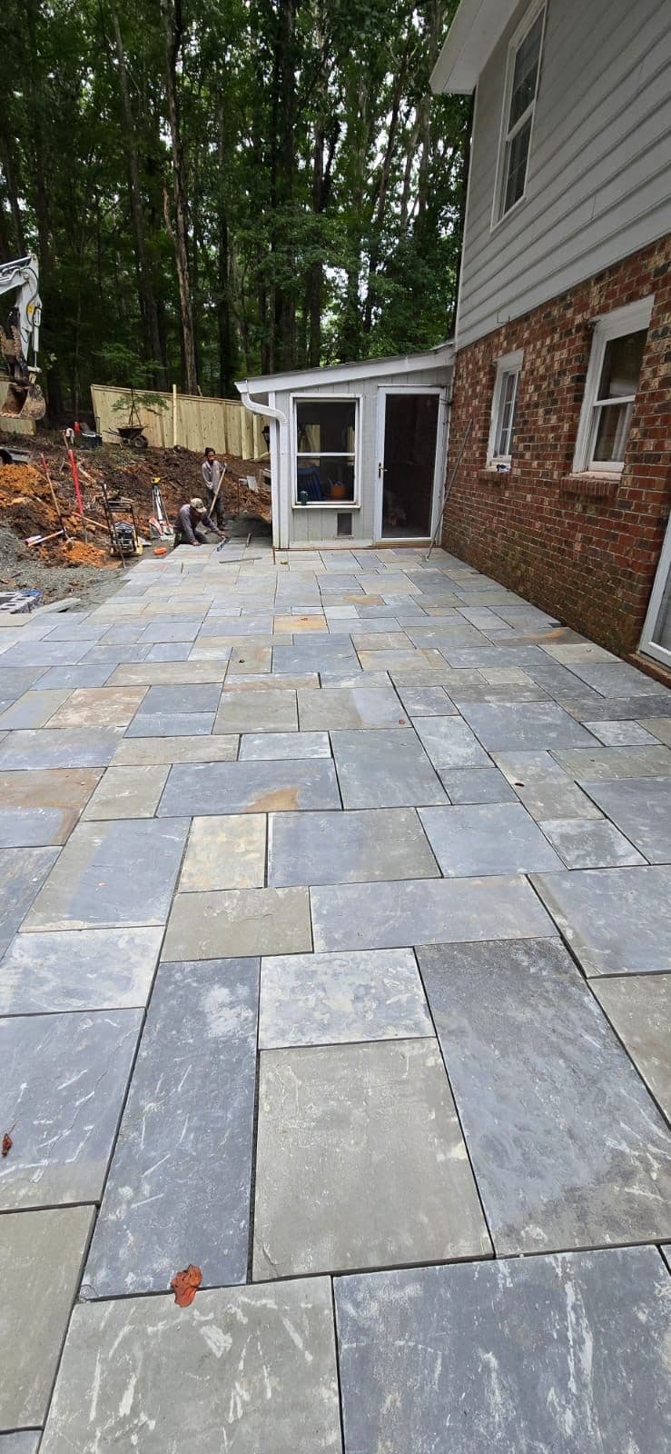 Transformative Ashlar Patio and Retaining Wall